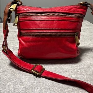 Fossil Explorer crossbody bag in red leather.